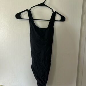 Size small black one piece bathing suit. Back is crisscrossed.